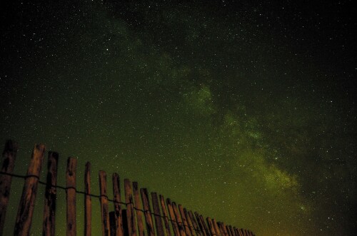 milky way over fence