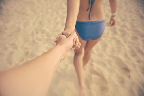 young-couple-holding-hands-and-walking-on-beach45dcecdd42551605.jpeg