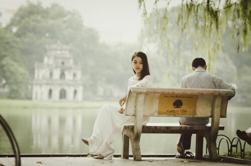 young-couple-sitting-on-bench-in-park-1286f73d0b7569864.jpeg